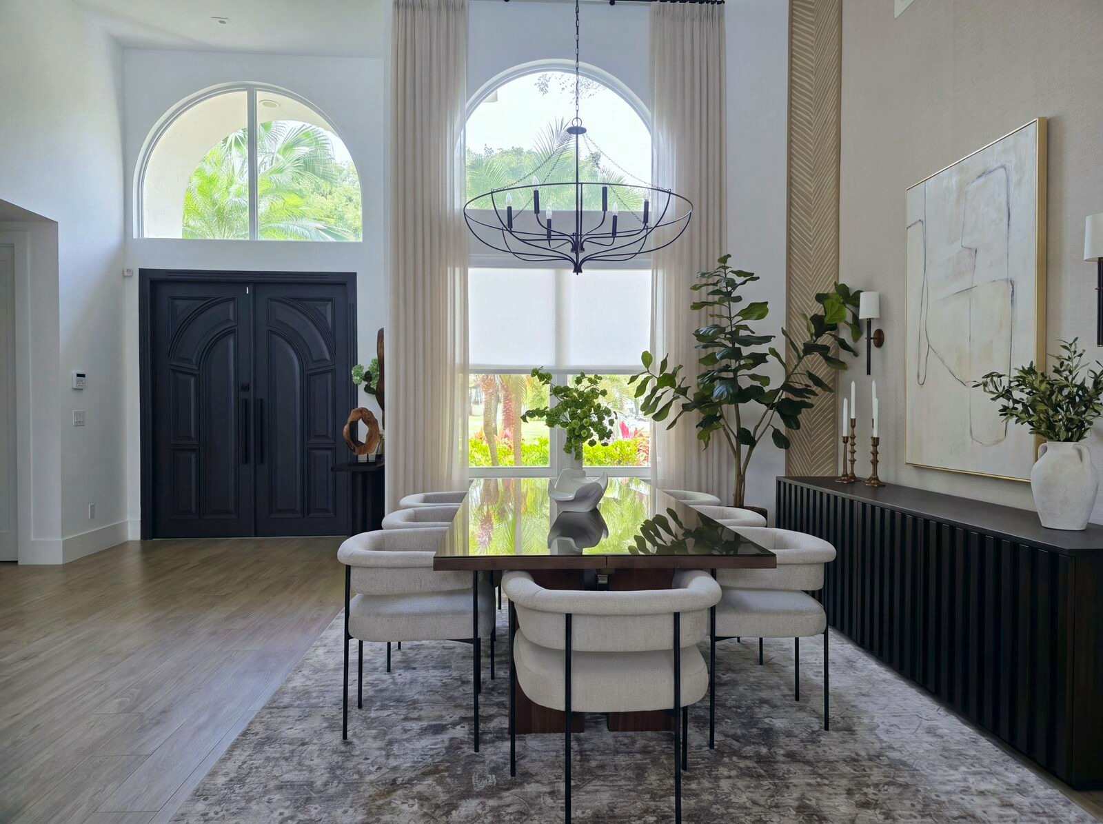 Dining room framed by black double doors