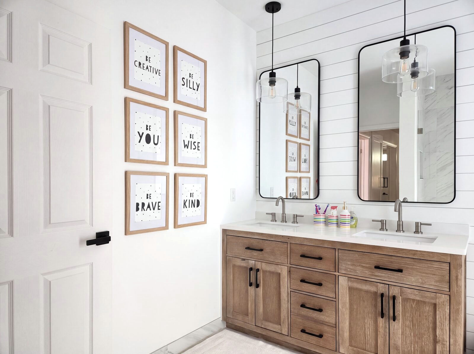 Bathroom with shiplap walls and white oak double vanity